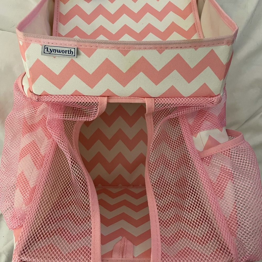 Baby diaper and wipe pink and white caddy. Purpose to hang over crib.